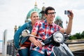 Scooter riding tourists taking selfie in front of Berlin Cathedr Royalty Free Stock Photo