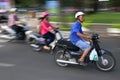 A scooter speeds through the streets of Hanoi, Vietnam