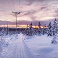 Scooter track and power line in remote place in Lapland