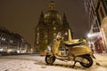 A scooter in the winter on the city streets of Europe, Germany, Dresden.