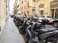 Scooters parked on a street in Rome