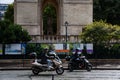 Scooters on the streets of Paris on a rainy day