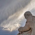 A scorch of Plato, the ancient Greek thinker on an impressive cloudy sky, space for your text and logo.