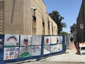 A scorched building in La Mesa, California, and posters of hope 2020