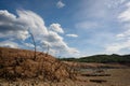 Scorched earth and earth clods are seen on dry land caused by drought and lack of rain due to climate change. Concept of water Royalty Free Stock Photo