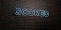 SCORED -Realistic Neon Sign on Brick Wall background - 3D rendered royalty free stock image