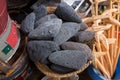 Scoria stone, volcanic rock, black lava rough stones full of holes vesicles in dark color selling at Mto wa Mbu village, Tanzania Royalty Free Stock Photo