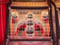 Scoring area of skee ball game behind a net with values of 10 to 100 Royalty Free Stock Photo