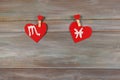 Scorpion and fish. signs of the zodiac and heart. wooden backgro