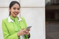 Scort woman with tablet and mobile phone smiling