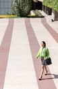 Scort woman with tablet and mobile phone smiling