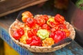 Scotch bonnet. Bonney, Caribbean peppers. Bahama Mama. Jamaican Hot. Bahamian. Martinique pepper. Vegetables in basket on street d