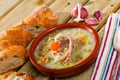 Scotch broth with barley, lamb, vegetables, peas in clay bowl Royalty Free Stock Photo