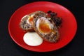 scotch egg, boiled egg wrapped in sausage meat, coated in breadcrumbs and baked or deep-fried Royalty Free Stock Photo