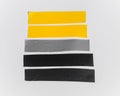 Set scotch tape colorful gray yellow black, sticky tape cut on white background. Royalty Free Stock Photo