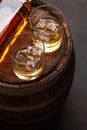 Scotch whiskey bottle, glass and old barrel Royalty Free Stock Photo