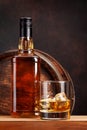 Scotch whiskey bottle, glass and old barrel Royalty Free Stock Photo