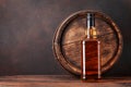Scotch whiskey bottle and old barrel Royalty Free Stock Photo