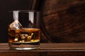 Scotch whiskey glass and old barrel Royalty Free Stock Photo