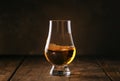 Scotch Whiskey without ice in glass, rustic wood background, copy space Royalty Free Stock Photo