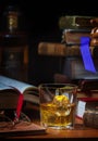 Scotch Whisky with Ice and Old Books Royalty Free Stock Photo