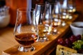 Scotch whisky, tasting glasses with variety of single malts or blended whiskey spirits on distillery tour in Scotland