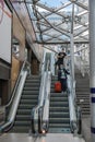 Edinburg central train station. Interior of station with escalators and people waiting boarding Royalty Free Stock Photo