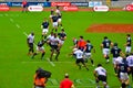Scotland players rushing Flying Fijians for Rugby Ball