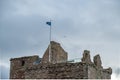 Scotlands Saltire Flag Flying High on Top of One of Scotlands Historic Castle Ruins the SNP`s sign of Independance for Scotland Royalty Free Stock Photo