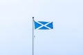 Scotlands Saltire Flag Flying High on Top of One of Scotlands Historic Castles in Seamill Scotland Royalty Free Stock Photo