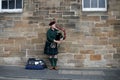 Scottish Bagpiper playing music with bagpipe at Edinburgh in Scotland 19 07 2019 Royalty Free Stock Photo