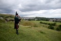 Scottish Bagpiper playing music with bagpipe at Edinburgh in Scotland 19 07 2019 Royalty Free Stock Photo