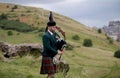 Scottish Bagpiper playing music with bagpipe at Edinburgh in Scotland 19 07 2019 Royalty Free Stock Photo