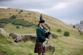 Scottish Bagpiper playing music with bagpipe at Edinburgh in Scotland 19 07 2019 Royalty Free Stock Photo