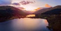 Scottish beautiful colorful sunset landscape with Loch Voil, mountains and forest at Loch Lomond & The Trossachs National Park Royalty Free Stock Photo