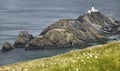 Scottish coastline landscape with lighthouse in Shetland islands Royalty Free Stock Photo