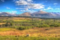 Scottish countryside and snow topped mountains Ben Nevis Scotland UK in colourful HDR Royalty Free Stock Photo