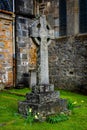 Scottish Cross Statue and Tombstone at St John Church in Ballachulish Scotland UK