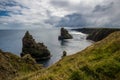 Wide angle view of the Duncansby Stacks under a gloomy sky