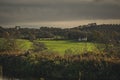 Scottish Farm in autumn landscape with dramatic clouds