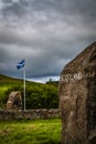 Scottish Flag and Carved Stones Marking the Border Between Scotland and England Royalty Free Stock Photo