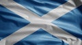 Scottish flag waving in the wind. Close up of Scotland banner blowing soft silk Royalty Free Stock Photo