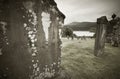 Scottish graveyard and Loch Ness in sepia tone Royalty Free Stock Photo