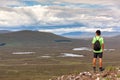 Scottish highland landscape: boy hiking in Glencoe mountain. Scotland, UK Royalty Free Stock Photo