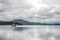 A scottish lake with a solitary sailboat Royalty Free Stock Photo