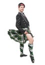 Scottish man in traditional national costume with blowing kilt Royalty Free Stock Photo