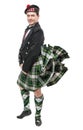 Scottish man in traditional national costume with blowing kilt Royalty Free Stock Photo