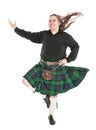 Scottish man in traditional national costume with blowing kilt Royalty Free Stock Photo