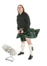 Scottish man in traditional national costume with blowing kilt Royalty Free Stock Photo