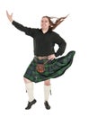 Scottish man in traditional national costume with blowing kilt Royalty Free Stock Photo